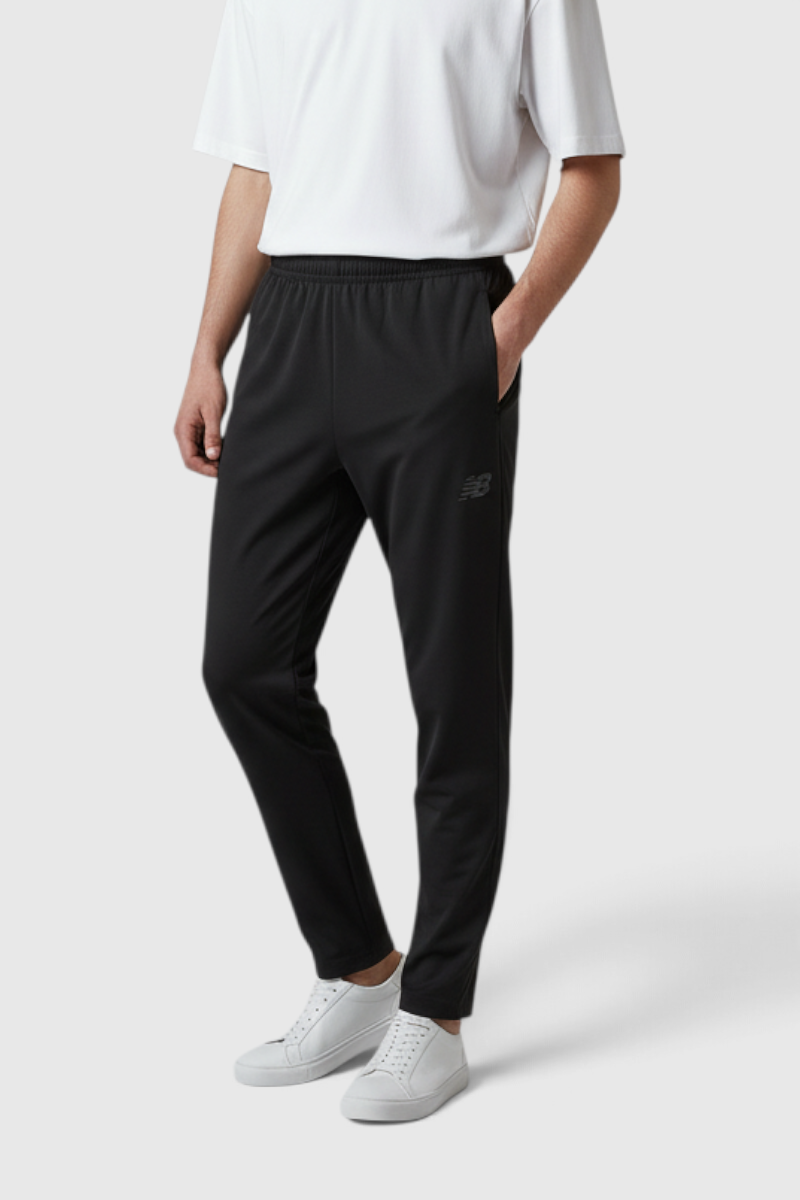Sporline New Balance siyah regular kesim erkek eşofman altı, polyester ve elastan karışımlı spor giyim.