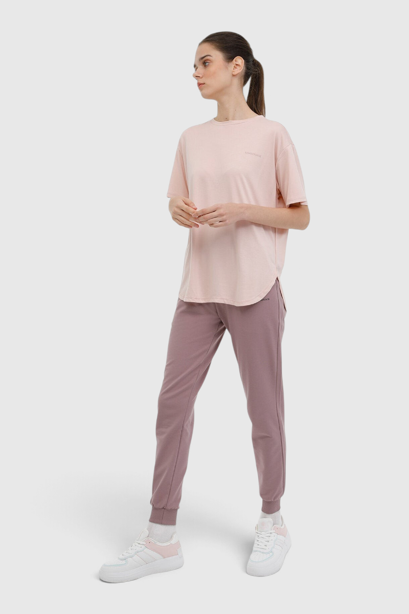 Sporline Lumberjack pastel mor jogger kesim kadın eşofman altı, polyester ve elastan karışımlı rahat spor giyim.