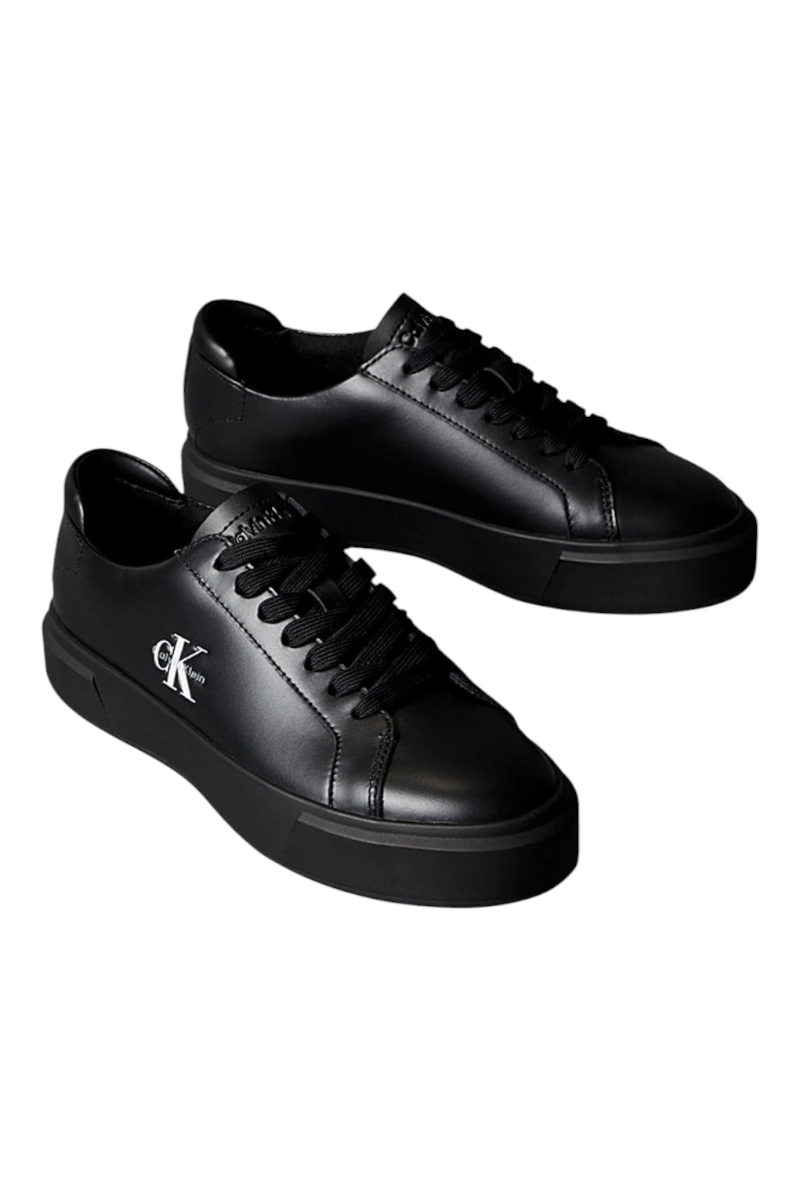 Sporline Calvin Klein siyah deri kadın sneaker, yan kısmında beyaz marka logolu, kalın tabanlı günlük spor ayakkabı.