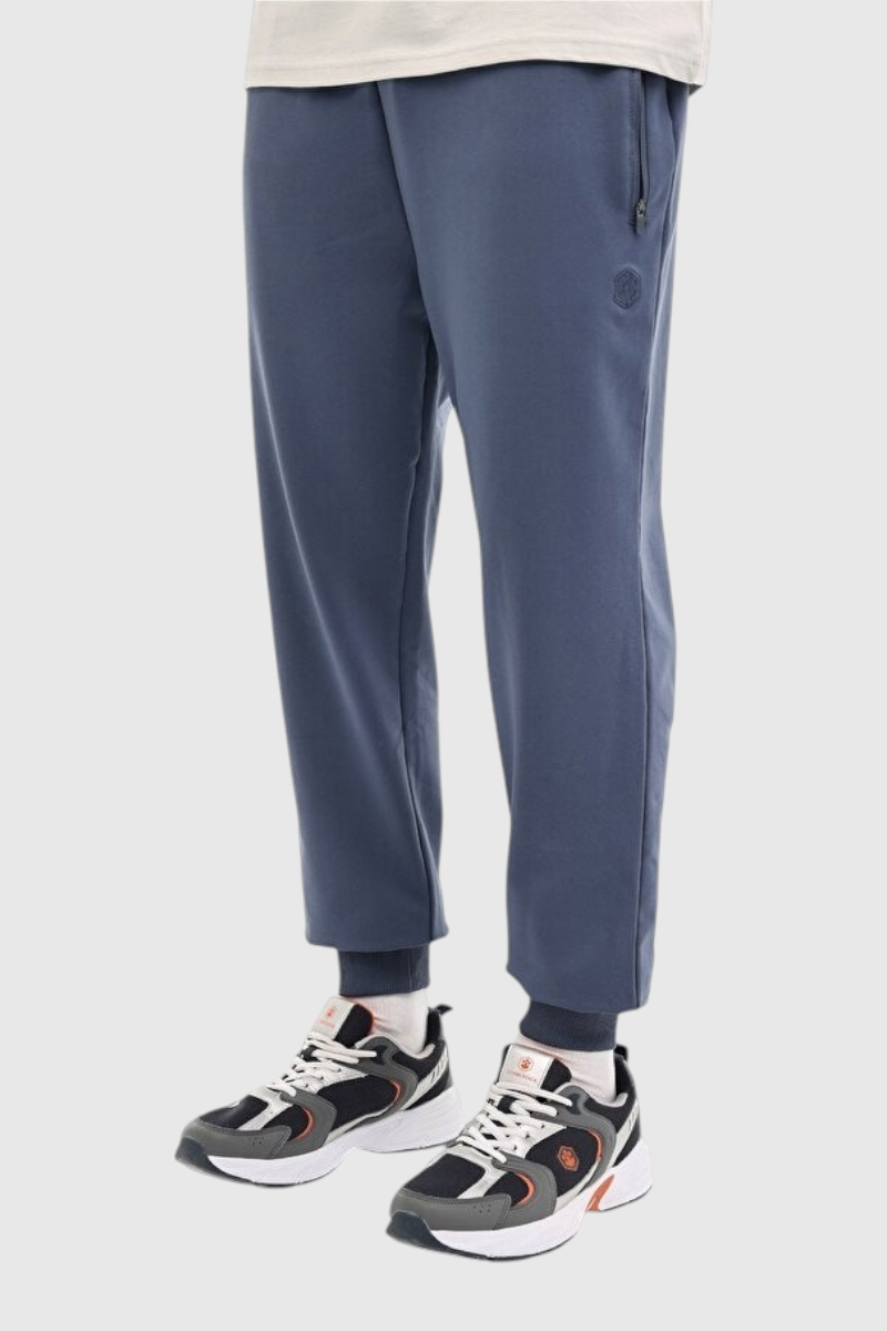 Sporline Lumberjack mavi jogger erkek eşofman altı, pamuk karışımlı kumaş ve fermuarlı cep detayı ile.
