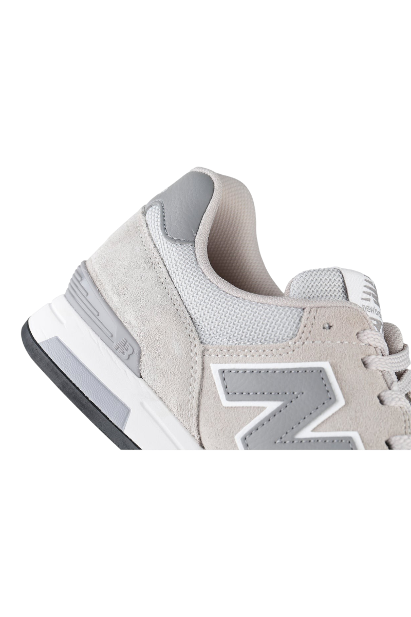Sporline New Balance ML565GGR gri süet ve file detaylı erkek casual spor ayakkabı topuk ve yan profil görünümü