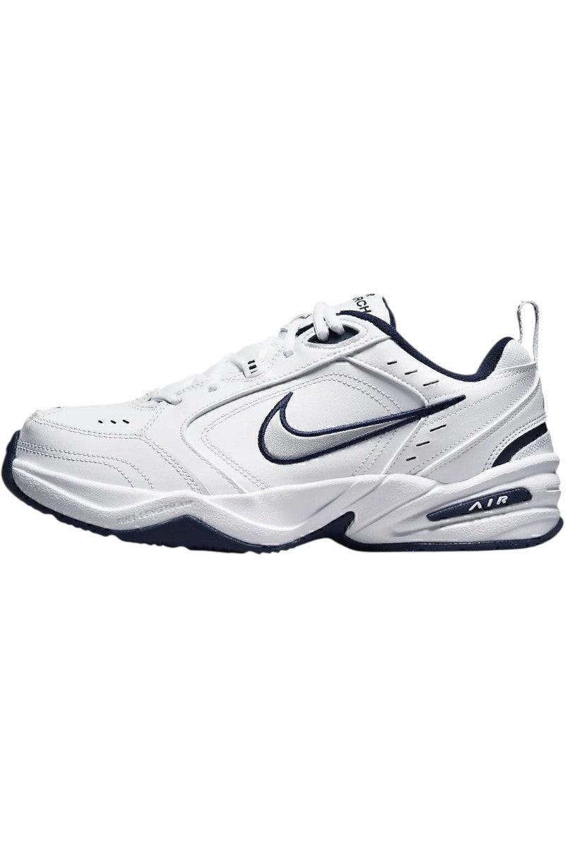 Sporline Nike Air Monarch IV beyaz ve gümüş detaylı erkek spor ayakkabı, yan profil görünümü.