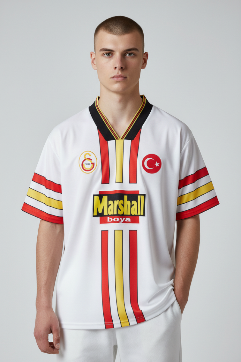Sporline Puma Galatasaray 1998-1999 sezonu beyaz çocuk retro forma, polyester kumaş ve klasik Marshall sponsor logolu