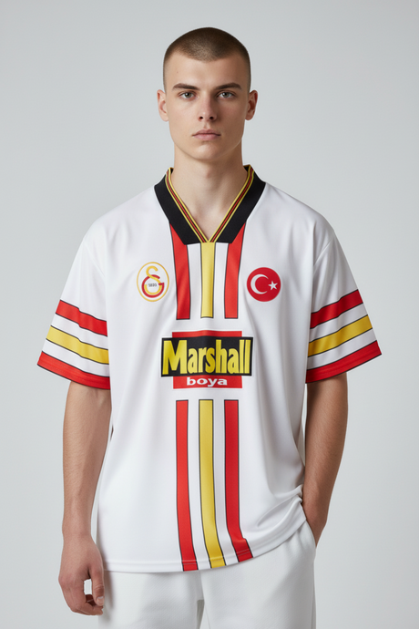 Sporline Puma Galatasaray 1998-1999 sezonu beyaz çocuk retro forma, polyester kumaş ve klasik Marshall sponsor logolu