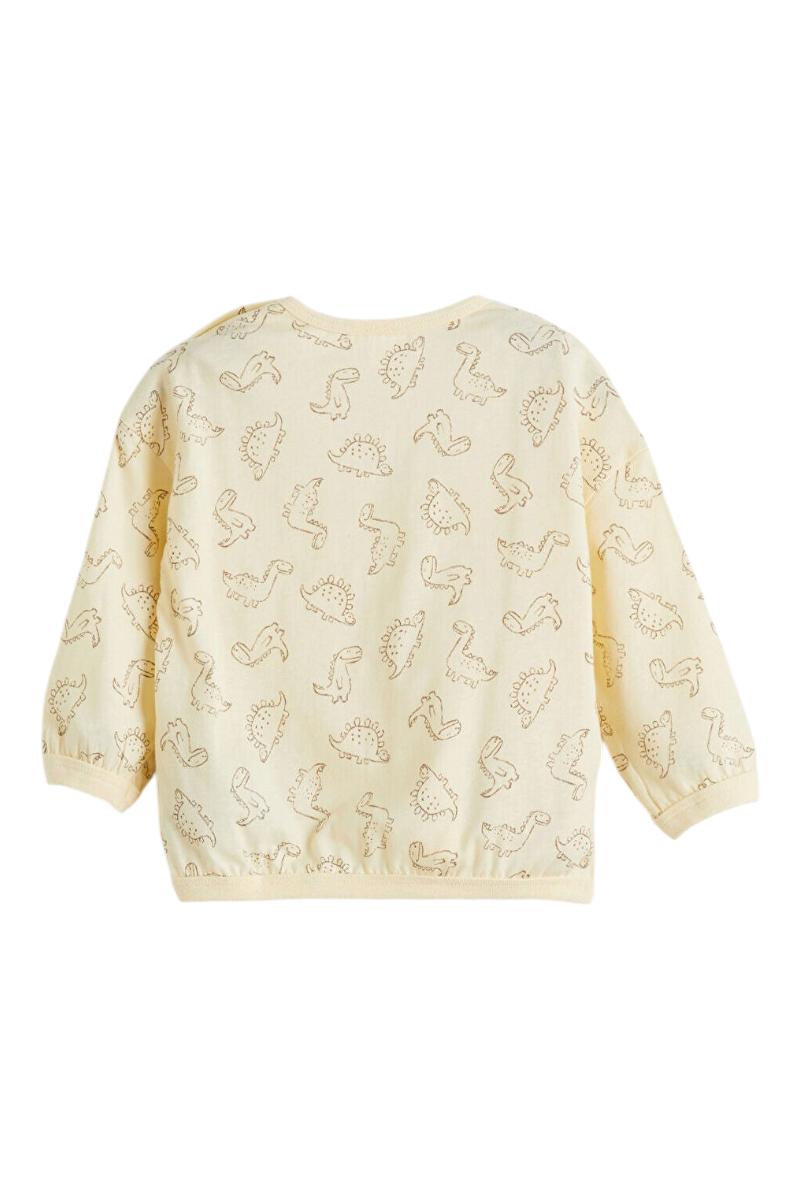 Sporline LC Waikiki çocuk pijama üstü, kırık beyaz renkli, dinozor desenli, %100 pamuklu uzun kollu tasarım