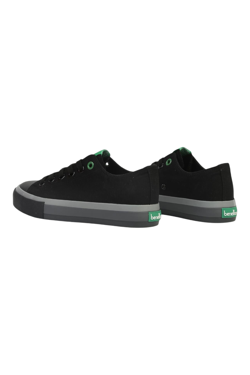 Sporline Benetton siyah kanvas kadın sneaker, yeşil detaylı kauçuk taban ve topuk logosu ile günlük spor ayakkabı.