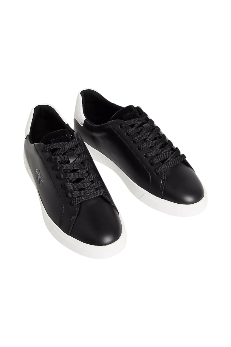 Sporline Calvin Klein siyah deri kadın sneaker, beyaz tabanlı şık ve modern günlük spor ayakkabı tasarımı.