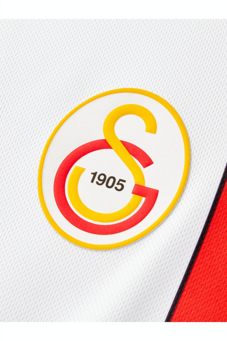 Sporline Puma Galatasaray 1998-1999 sezonu beyaz çocuk retro forma üzerinde sarı kırmızı Galatasaray kulüp arması
