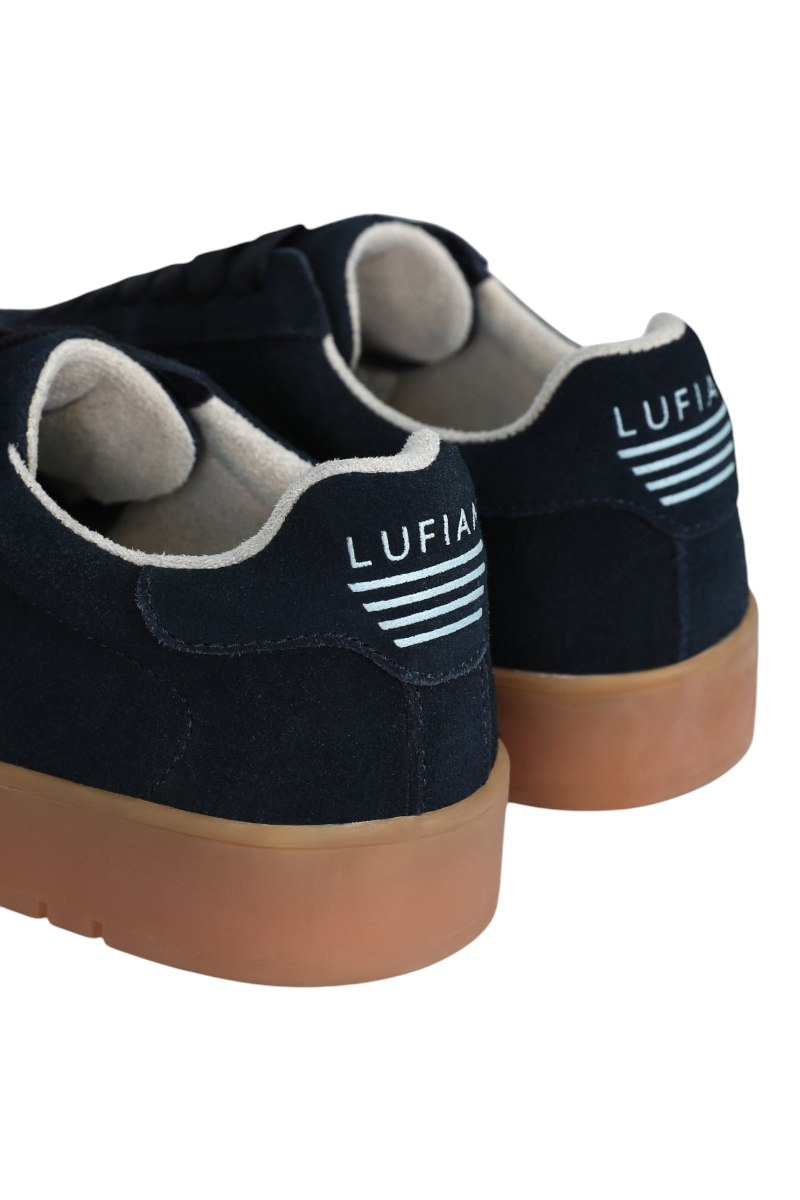 Sporline Lufian lacivert deri kadın sneaker, topuk kısmında beyaz marka detaylı ve taba rengi tabanlı günlük ayakkabı
