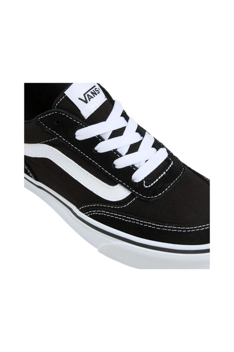 Sporline Vans Brooklyn siyah beyaz kadın sneaker, kanvas kumaş ve ikonik yan şerit detaylı spor ayakkabı.