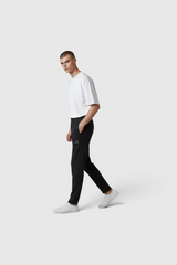 Sporline New Balance erkek siyah regular kesim polyester eşofman altı giyen model