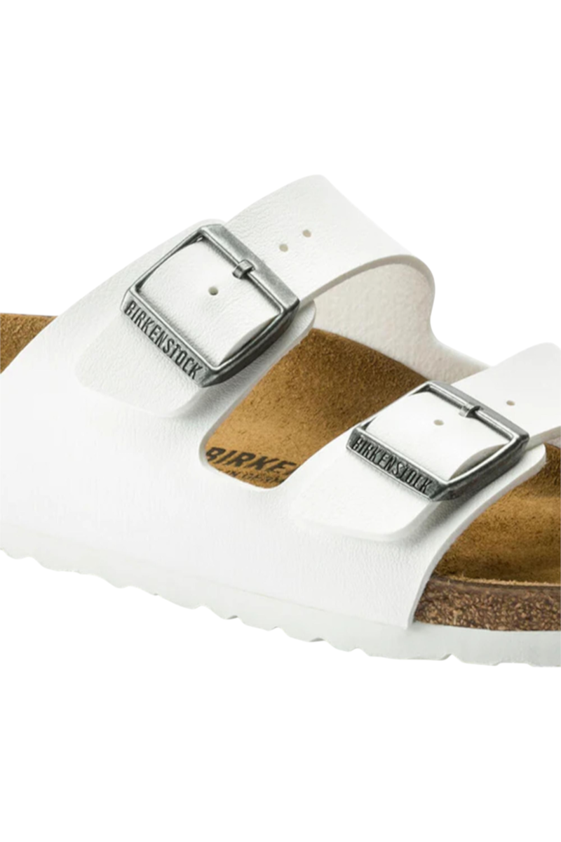 Sporline Birkenstock Arizona beyaz süet kadın terlik, metal tokalı çift bantlı tasarım ve mantar taban detayı.