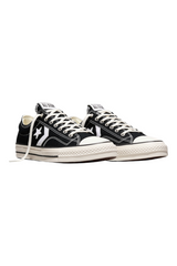 Sporline Converse Star Player 76 siyah beyaz tekstil spor ayakkabı, kauçuk tabanlı ve ikonik yıldız logolu tasarım.