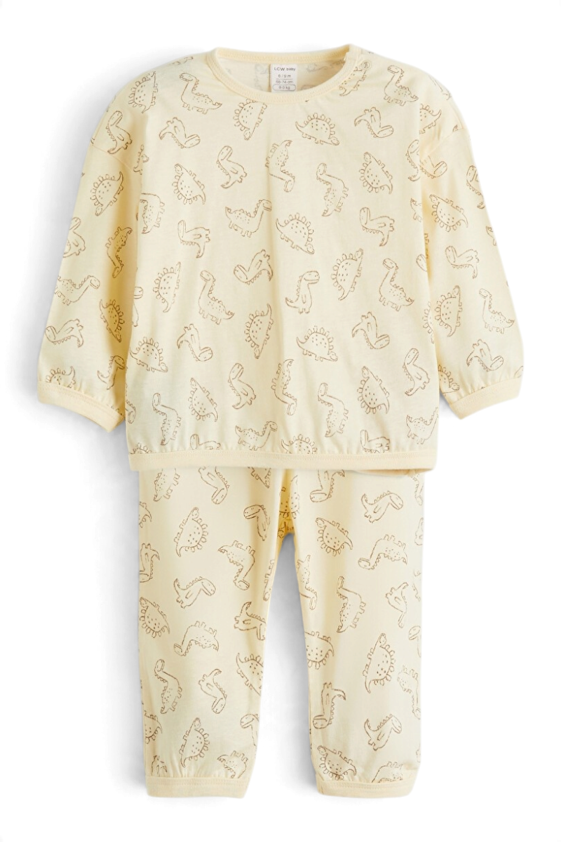 Sporline LC Waikiki çocuk pijama takımı, kırık beyaz renkli, dinozor desenli, %100 pamuklu rahat ev giyimi.
