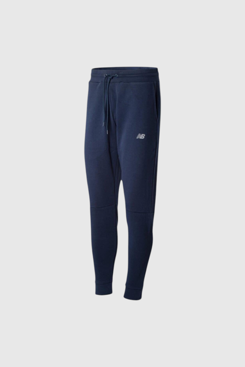 Sporline New Balance lacivert erkek eşofman altı, dokuma kumaşlı, normal bel ve standart boy kesimli spor pantolon.