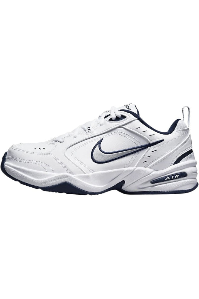 Sporline Nike Air Monarch IV beyaz ve gümüş detaylı erkek spor ayakkabı, yan profil görünümü.